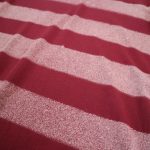 Detail of Stripes Danga model on burgundy organic cotton unisex tshirt
